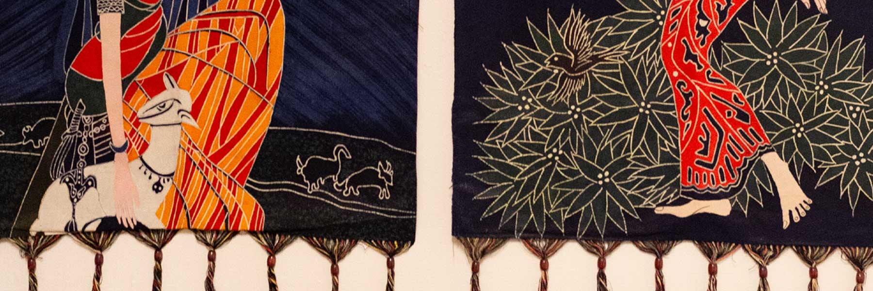 A closeup of brightly decorated woven wall hangings at the Ostrom Workshop. 